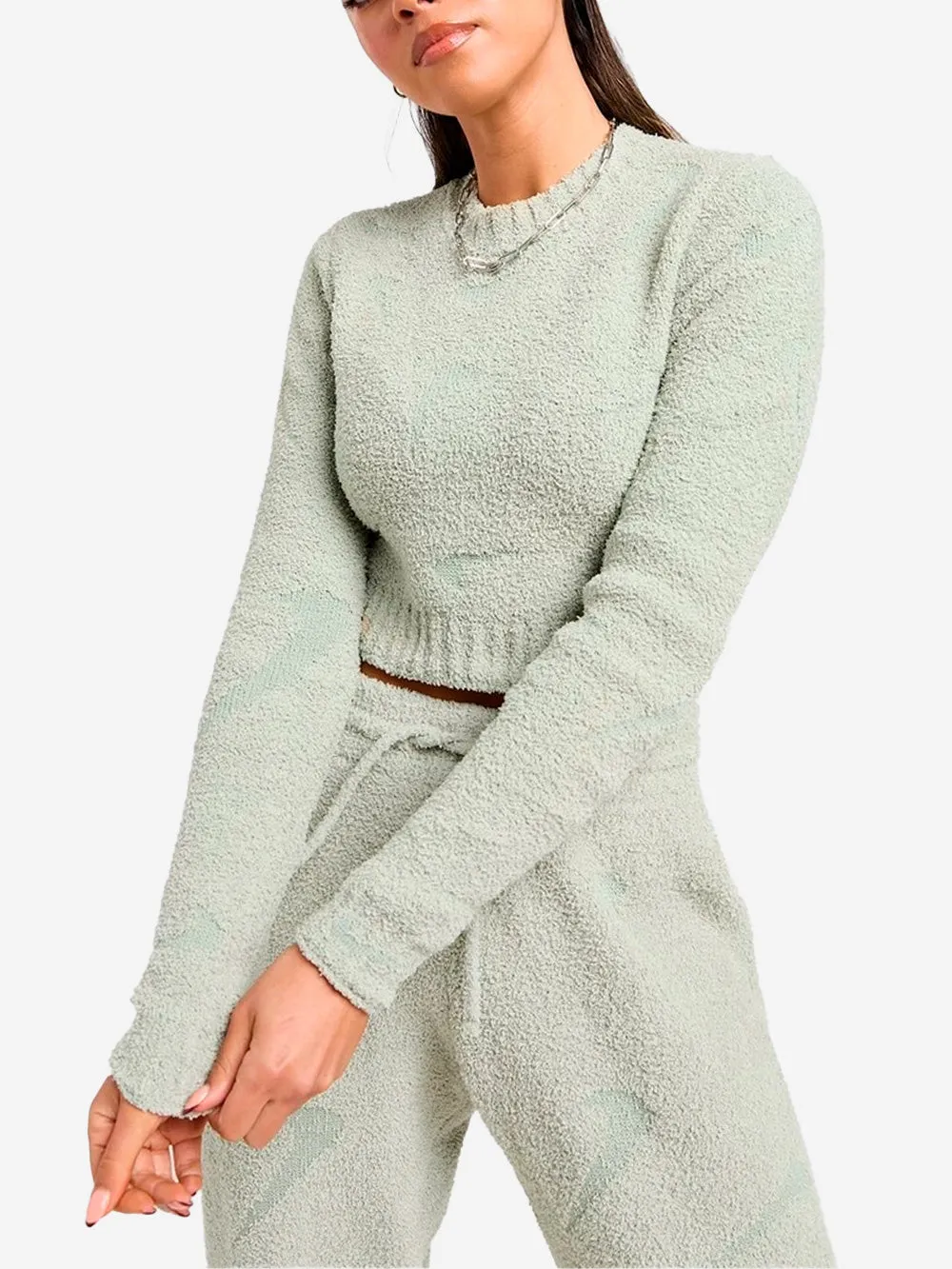 W top aderente a maniche lunghe bouclé verde
